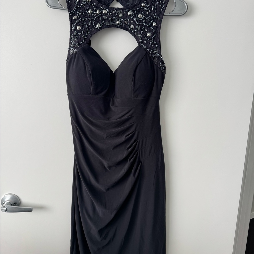 Elegant Blue Sleeveless Dress with Embellished Neckline